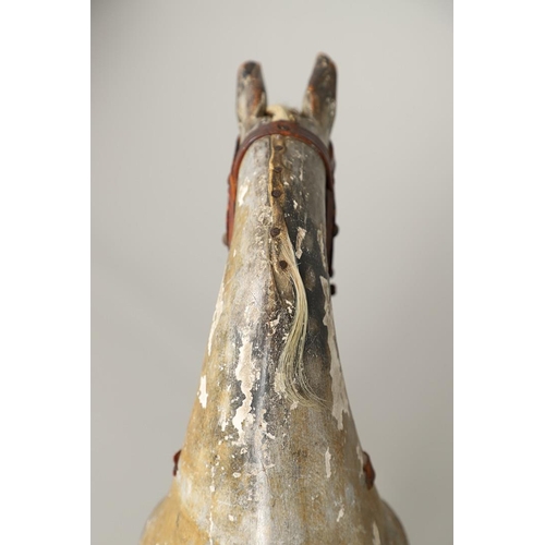 532 - F H AYRES - ANTIQUE ROCKING HORSE. A carved and painted pine rocking horse, mounted with a padded se... 