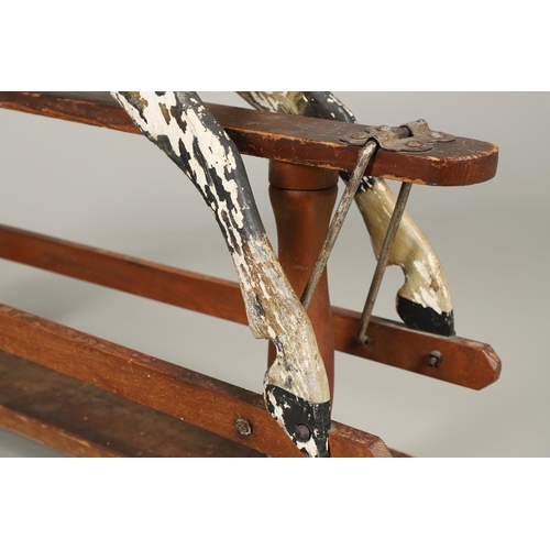 532 - F H AYRES - ANTIQUE ROCKING HORSE. A carved and painted pine rocking horse, mounted with a padded se... 