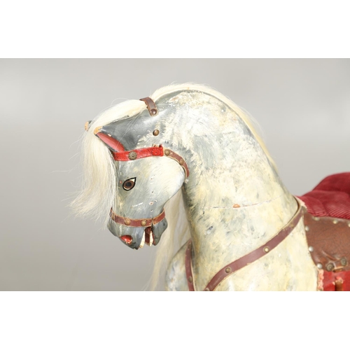 535 - ANTIQUE ROCKING HORSE. A antique painted rocking horse, fitted with a saddle and bridle and mounted ... 