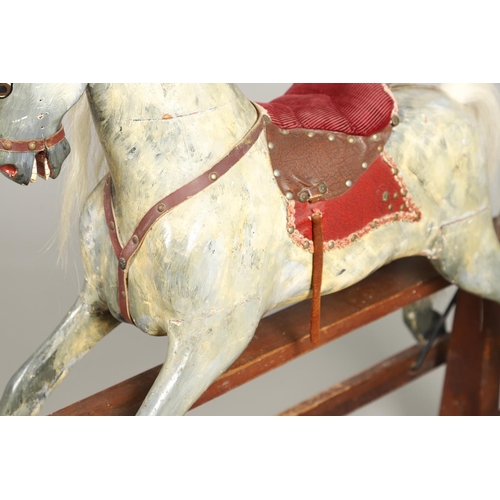 535 - ANTIQUE ROCKING HORSE. A antique painted rocking horse, fitted with a saddle and bridle and mounted ... 