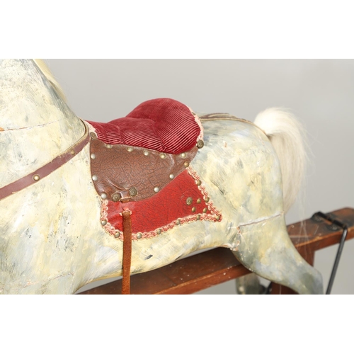 535 - ANTIQUE ROCKING HORSE. A antique painted rocking horse, fitted with a saddle and bridle and mounted ... 