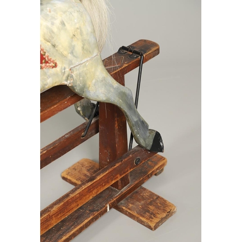 535 - ANTIQUE ROCKING HORSE. A antique painted rocking horse, fitted with a saddle and bridle and mounted ... 