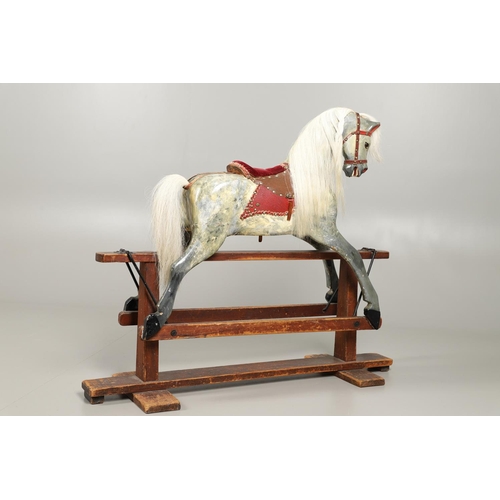 535 - ANTIQUE ROCKING HORSE. A antique painted rocking horse, fitted with a saddle and bridle and mounted ... 