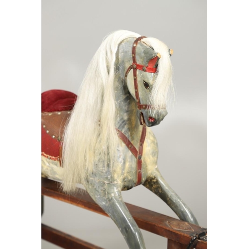 535 - ANTIQUE ROCKING HORSE. A antique painted rocking horse, fitted with a saddle and bridle and mounted ... 