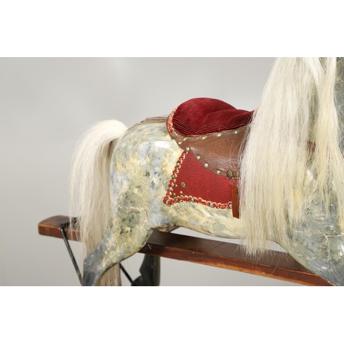 535 - ANTIQUE ROCKING HORSE. A antique painted rocking horse, fitted with a saddle and bridle and mounted ... 