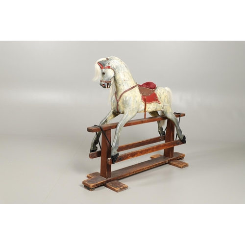 535 - ANTIQUE ROCKING HORSE. A antique painted rocking horse, fitted with a saddle and bridle and mounted ... 