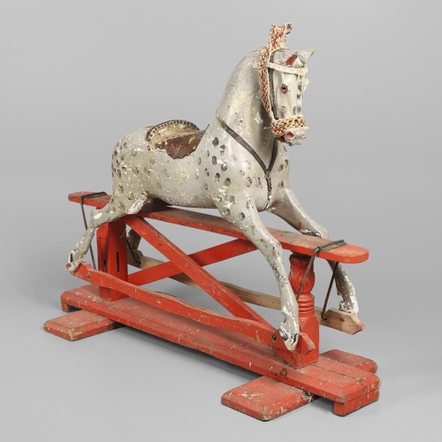 544 - LARGE 19THC PAINTED WOODEN ROCKING HORSE. A large late 19thc painted wooden rocking horse, with part... 