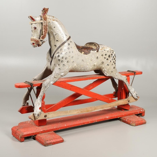 544 - LARGE 19THC PAINTED WOODEN ROCKING HORSE. A large late 19thc painted wooden rocking horse, with part... 