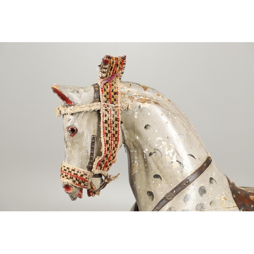 544 - LARGE 19THC PAINTED WOODEN ROCKING HORSE. A large late 19thc painted wooden rocking horse, with part... 