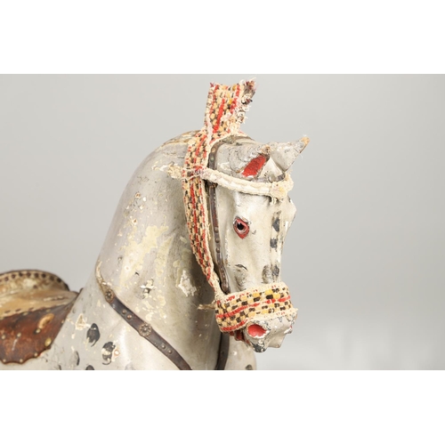 544 - LARGE 19THC PAINTED WOODEN ROCKING HORSE. A large late 19thc painted wooden rocking horse, with part... 