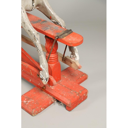 544 - LARGE 19THC PAINTED WOODEN ROCKING HORSE. A large late 19thc painted wooden rocking horse, with part... 