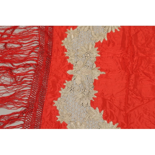 561 - ANTIQUE RED SILK & EMBROIDERED SHAWL. Probably late 19thc, the dark red silk fringed shawl with poss... 