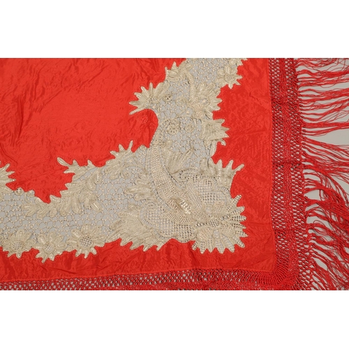 561 - ANTIQUE RED SILK & EMBROIDERED SHAWL. Probably late 19thc, the dark red silk fringed shawl with poss... 