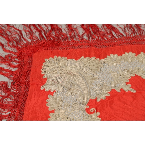 561 - ANTIQUE RED SILK & EMBROIDERED SHAWL. Probably late 19thc, the dark red silk fringed shawl with poss... 