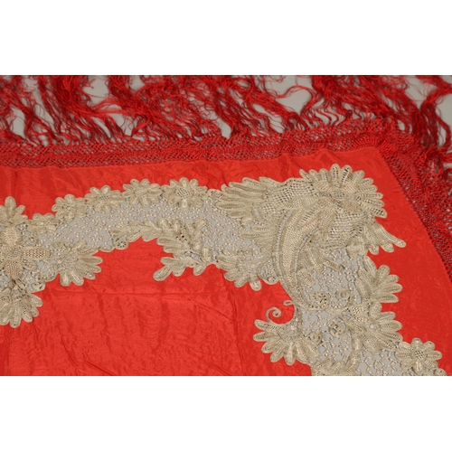 561 - ANTIQUE RED SILK & EMBROIDERED SHAWL. Probably late 19thc, the dark red silk fringed shawl with poss... 