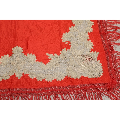 561 - ANTIQUE RED SILK & EMBROIDERED SHAWL. Probably late 19thc, the dark red silk fringed shawl with poss... 