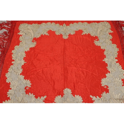 561 - ANTIQUE RED SILK & EMBROIDERED SHAWL. Probably late 19thc, the dark red silk fringed shawl with poss... 