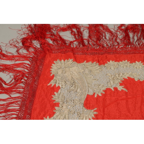 561 - ANTIQUE RED SILK & EMBROIDERED SHAWL. Probably late 19thc, the dark red silk fringed shawl with poss... 