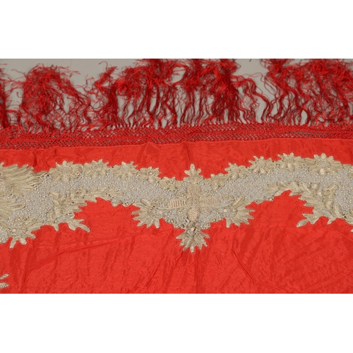 561 - ANTIQUE RED SILK & EMBROIDERED SHAWL. Probably late 19thc, the dark red silk fringed shawl with poss... 