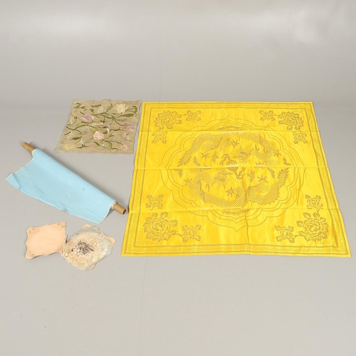 564 - VINTAGE TEXTILES INCLUDING CHINESE SILK PANEL. A mixed lot including a large panel of bright yellow ... 