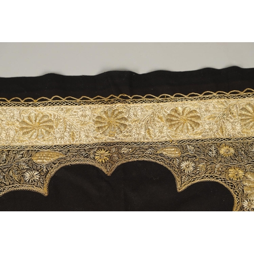 565 - EARLY 20THC INDIAN EMBROIDERED PANEL. A large gold coloured metallic embroidered panel, with a wide ... 