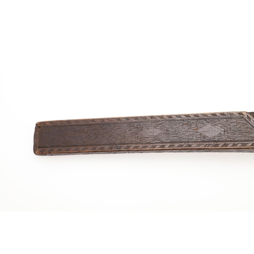 566 - TREEN INTEREST - EARLY KNITTING SHEATH. Probably early 19thc, of curved shape with chip carved decor... 