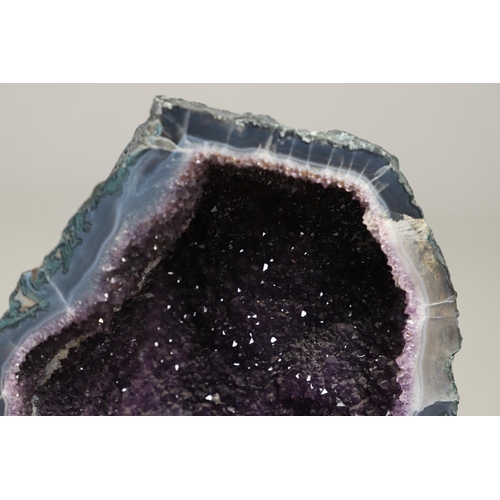 568 - LARGE AMETHYST GEODE. A large Amethyst geode, 35cms high, 31cms across at widest point.