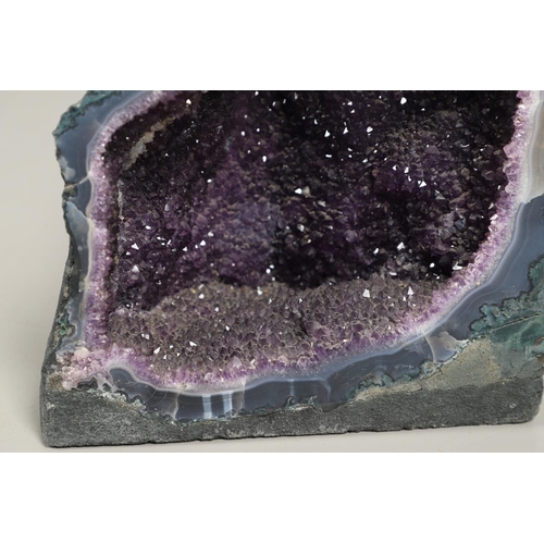 568 - LARGE AMETHYST GEODE. A large Amethyst geode, 35cms high, 31cms across at widest point.