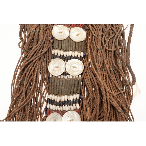 570 - TRIBAL - NUBA (SUDAN) WOMAN'S COSTUME. An elaborate costume to be secured around the waist, embellis... 