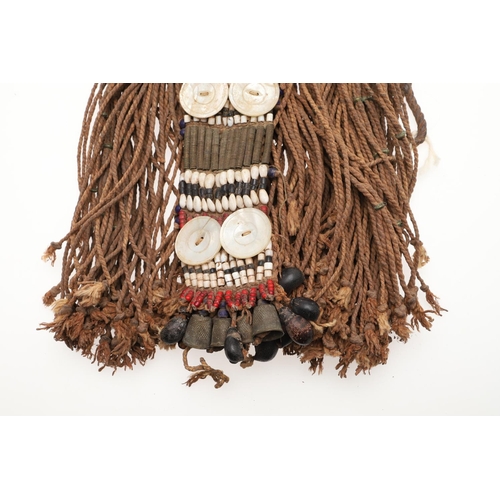 570 - TRIBAL - NUBA (SUDAN) WOMAN'S COSTUME. An elaborate costume to be secured around the waist, embellis... 