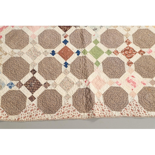 577 - 19THC VINTAGE PATCHWORK QUILT. The quilt worked in a palette of brown, blue, green and pink. Size 18... 