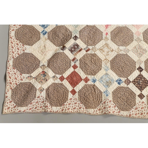 577 - 19THC VINTAGE PATCHWORK QUILT. The quilt worked in a palette of brown, blue, green and pink. Size 18... 