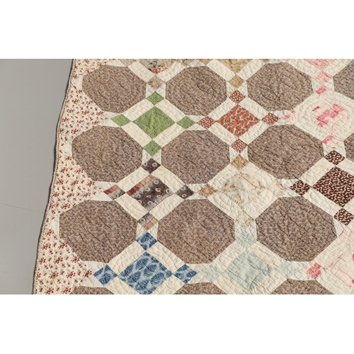 577 - 19THC VINTAGE PATCHWORK QUILT. The quilt worked in a palette of brown, blue, green and pink. Size 18... 