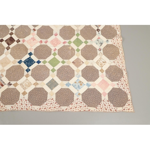 577 - 19THC VINTAGE PATCHWORK QUILT. The quilt worked in a palette of brown, blue, green and pink. Size 18... 