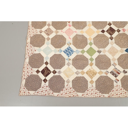 577 - 19THC VINTAGE PATCHWORK QUILT. The quilt worked in a palette of brown, blue, green and pink. Size 18... 