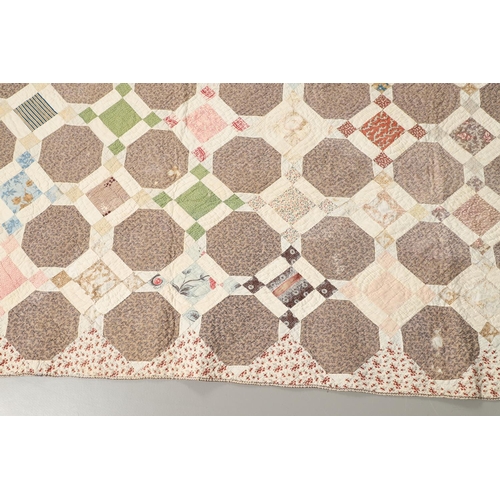 577 - 19THC VINTAGE PATCHWORK QUILT. The quilt worked in a palette of brown, blue, green and pink. Size 18... 