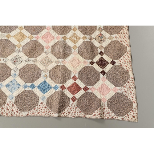 577 - 19THC VINTAGE PATCHWORK QUILT. The quilt worked in a palette of brown, blue, green and pink. Size 18... 