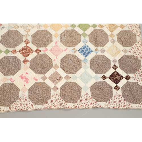 577 - 19THC VINTAGE PATCHWORK QUILT. The quilt worked in a palette of brown, blue, green and pink. Size 18... 