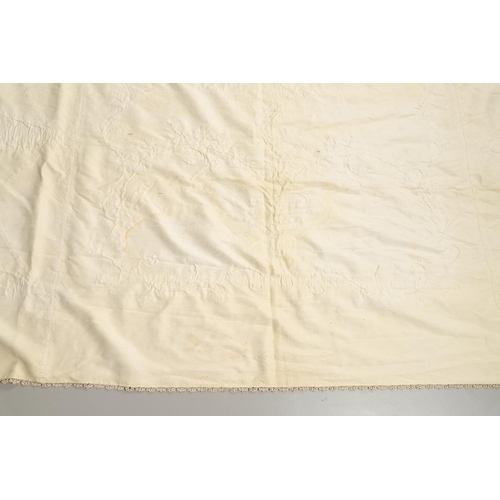 578 - VINTAGE IVORY SATIN BED COVER & OTHER TEXTILES. A late 19thc/early 20thc ivory coloured satin bed co... 