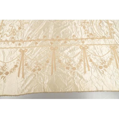 578 - VINTAGE IVORY SATIN BED COVER & OTHER TEXTILES. A late 19thc/early 20thc ivory coloured satin bed co... 