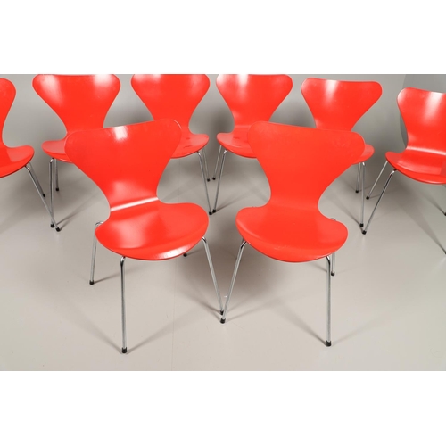 583 - FRITZ HANSEN - DANISH DESIGNER STACKING CHAIRS. A set of eight Series 7 red laminate wooden chairs w... 