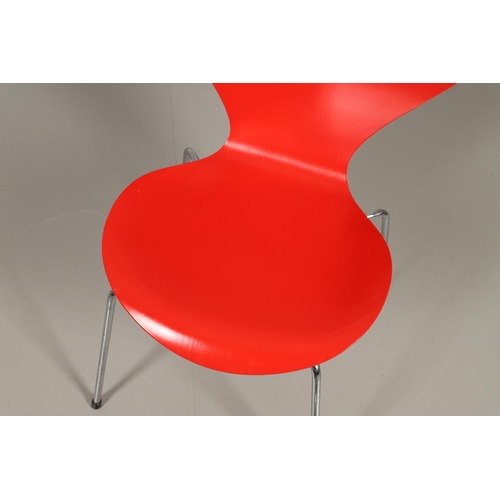 583 - FRITZ HANSEN - DANISH DESIGNER STACKING CHAIRS. A set of eight Series 7 red laminate wooden chairs w... 