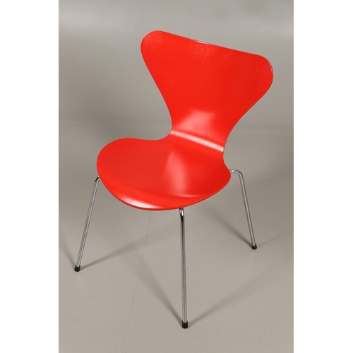 583 - FRITZ HANSEN - DANISH DESIGNER STACKING CHAIRS. A set of eight Series 7 red laminate wooden chairs w... 