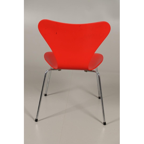 583 - FRITZ HANSEN - DANISH DESIGNER STACKING CHAIRS. A set of eight Series 7 red laminate wooden chairs w... 