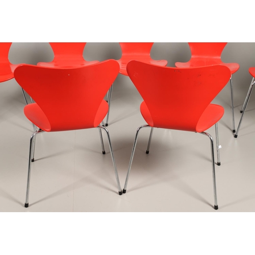 583 - FRITZ HANSEN - DANISH DESIGNER STACKING CHAIRS. A set of eight Series 7 red laminate wooden chairs w... 