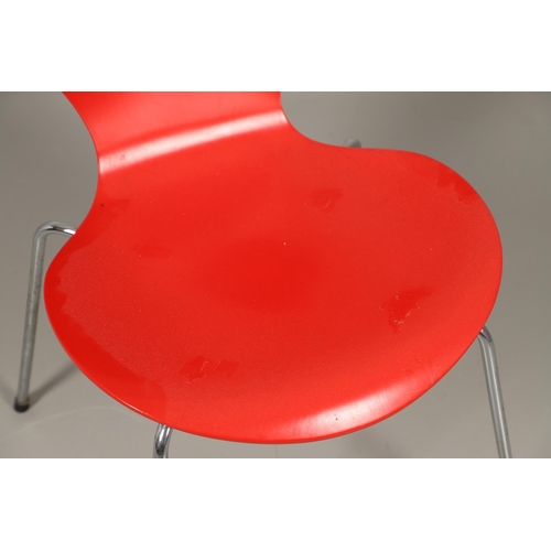 583 - FRITZ HANSEN - DANISH DESIGNER STACKING CHAIRS. A set of eight Series 7 red laminate wooden chairs w... 