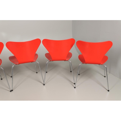 583 - FRITZ HANSEN - DANISH DESIGNER STACKING CHAIRS. A set of eight Series 7 red laminate wooden chairs w... 