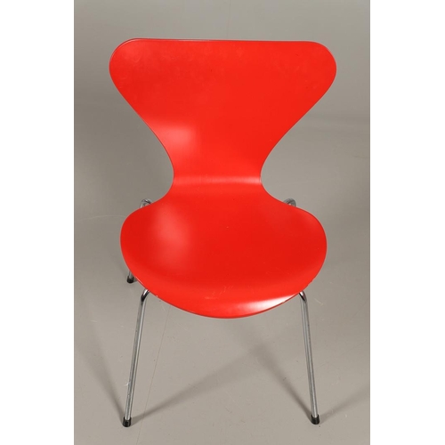 583 - FRITZ HANSEN - DANISH DESIGNER STACKING CHAIRS. A set of eight Series 7 red laminate wooden chairs w... 