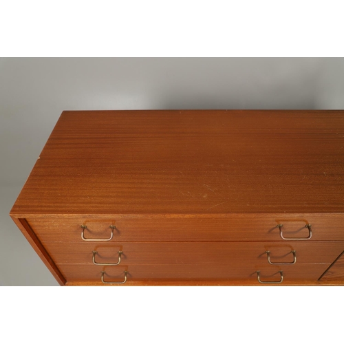 588 - MID CENTURY SIDEBOARD - UNIFLEX. A circa 1960's teak and afromosia sideboard, with three long drawer... 