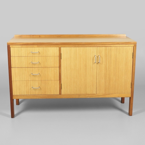 589 - MID CENTURY TEAK SIDEBOARD - MANN EGERTON, 1977. An interesting teak sideboard with a small raised b... 